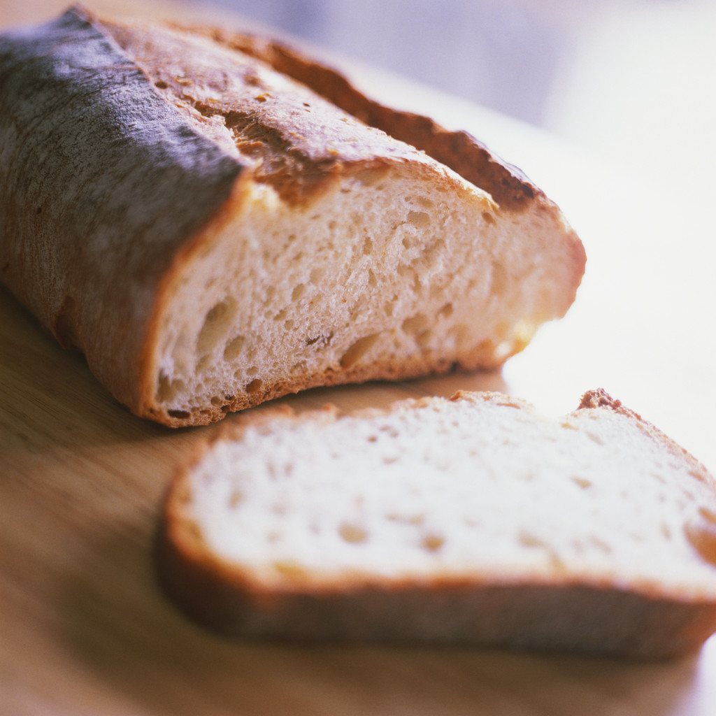 An innocent virgin loaf of bread...just ripe for mastication or destruction via vampire grocery store worker in name tag, featuring orange stick on the back with "booth bitch" engraved there upon.  Photo credit:  to clipart bitches!!