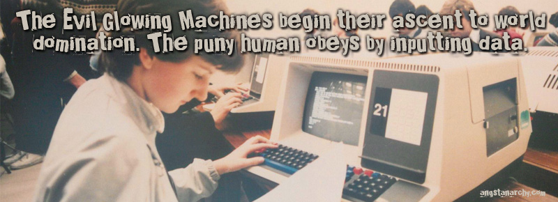 The Evil Glowing Machines begin their ascent to world domination. The puny human obeys by inputting data. Photo: 1980's computer